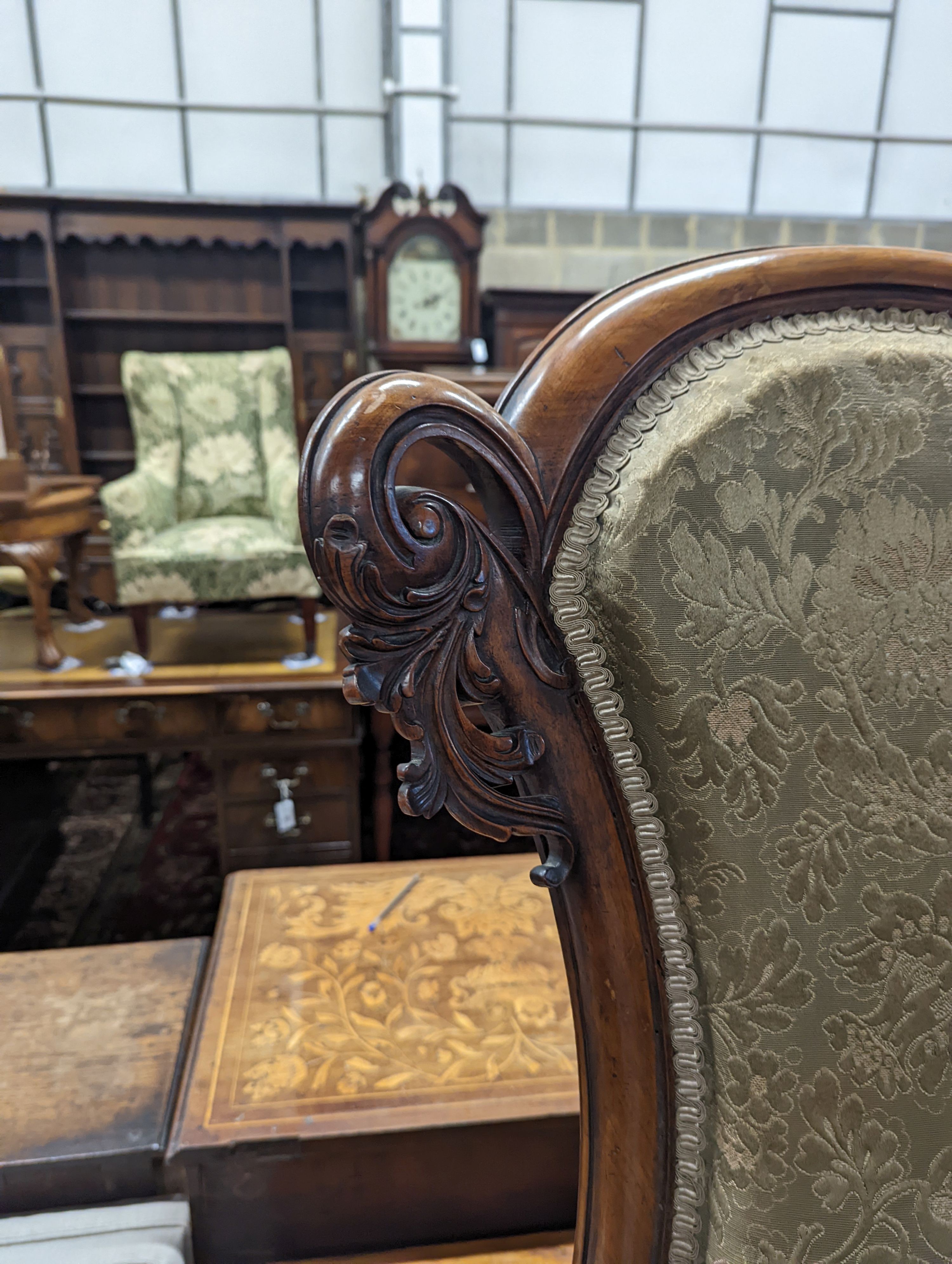 A Victorian walnut nursing chair together with a reproduction nest of tea tables